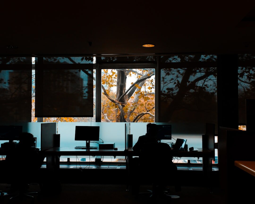 Modern editorial newsroom office with warm lighting