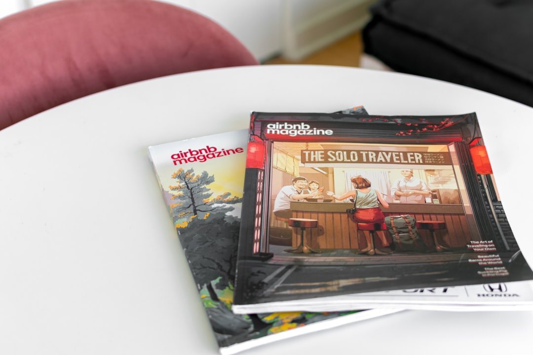 Magazine layout proofs spread across a light table